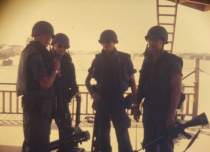 Marko (on right) and team mates waiting for boat ride.  Air Force team going for a cruise -- how odd