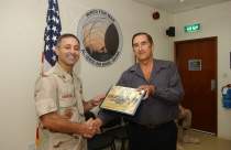 Marko in the Middle East receiving an Outstanding Civilian of the month award.